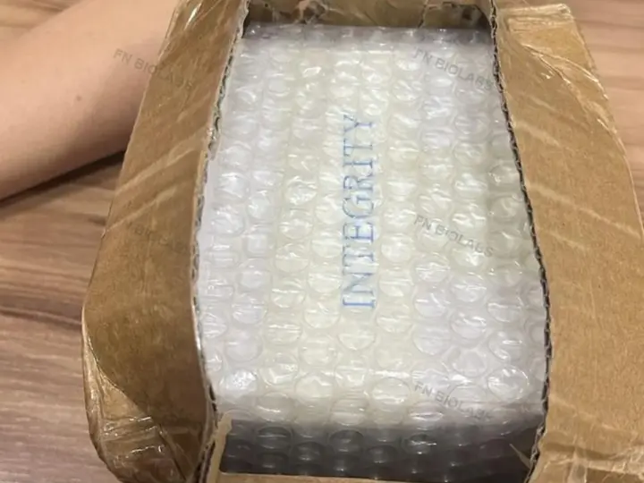 Customer-supplied photo of an opened parcel with protective bubble packaging
