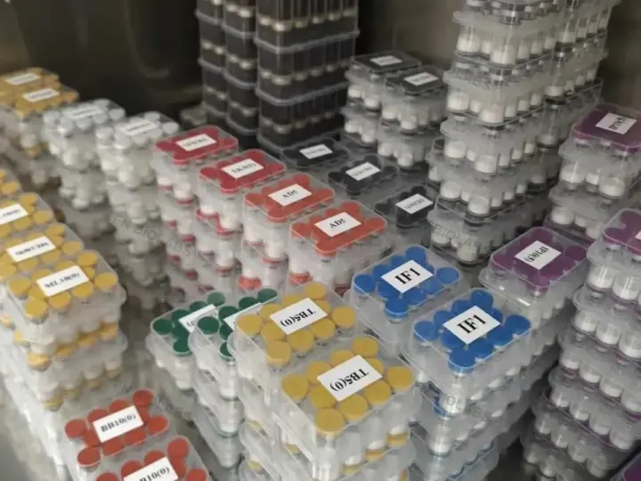 Multiple color-coded product cases organized in storage