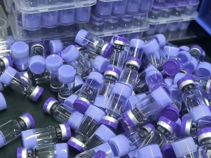 Blue-capped product vials organized in protective inventory trays